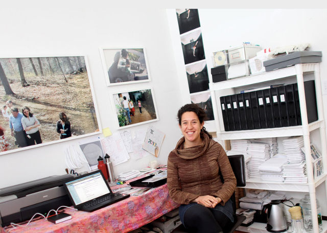 Stephanie Diamondsitting at desk in office